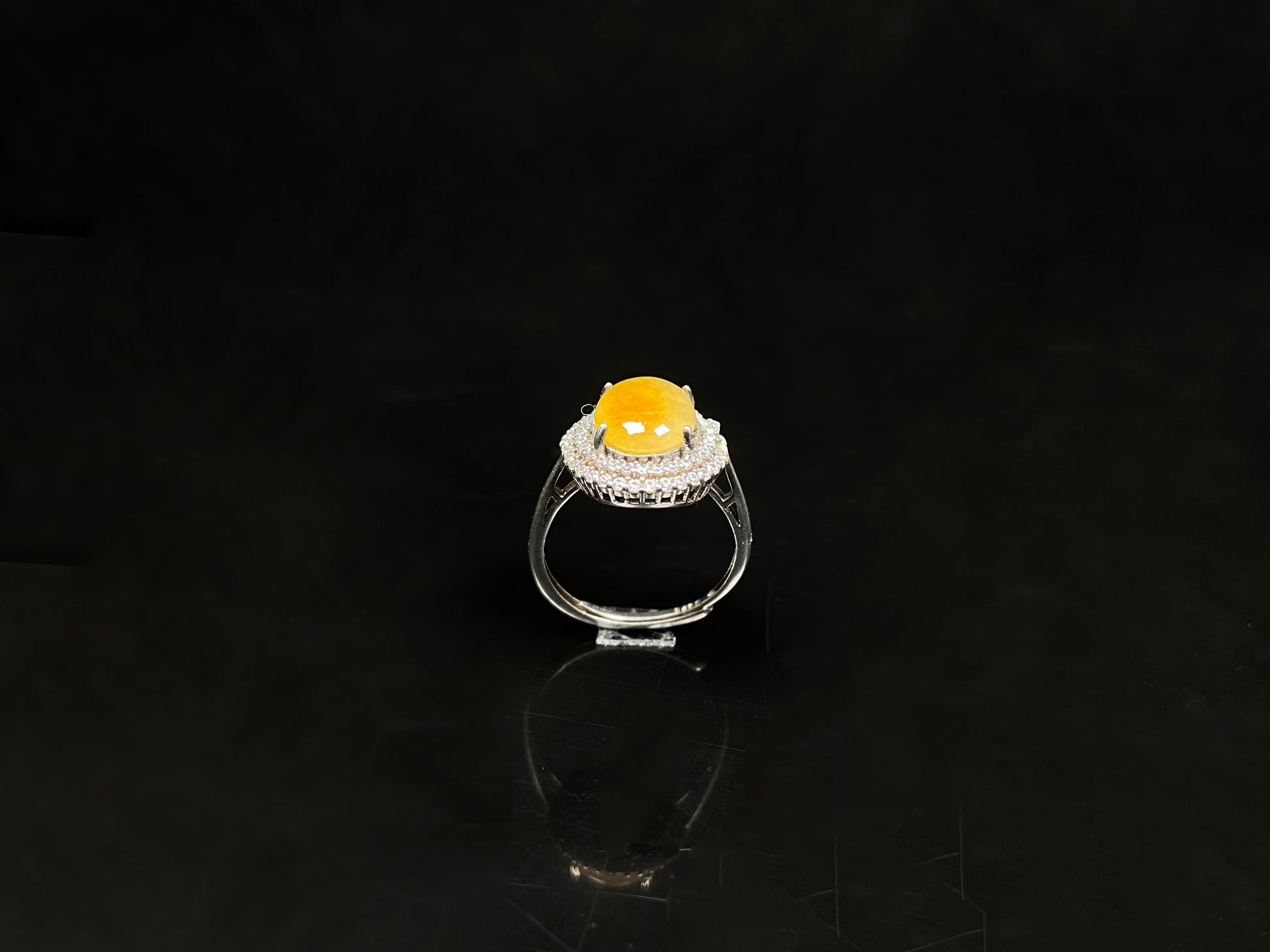 A sunlit nectar glow jadeite ring.