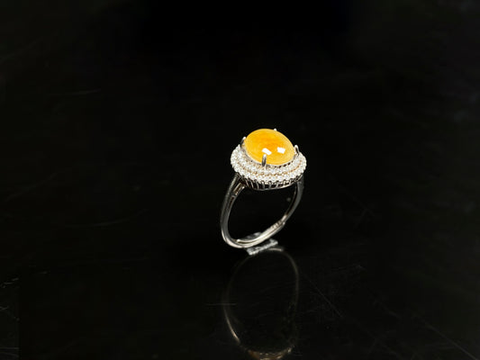 A sunlit nectar glow jadeite ring.