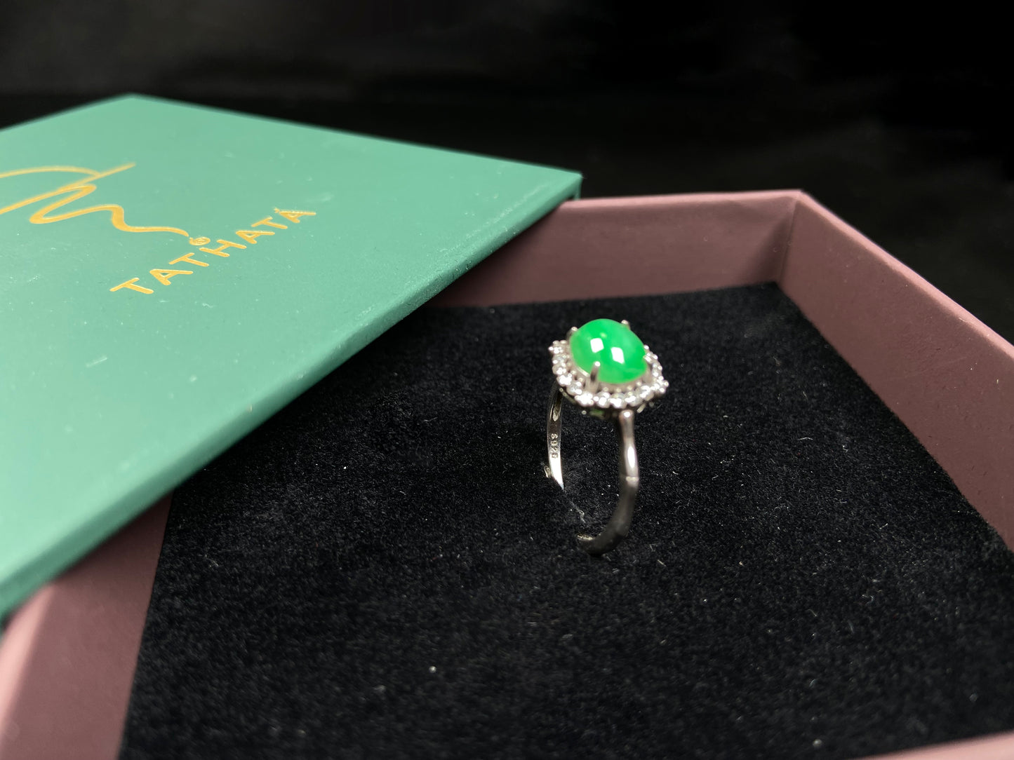 A jelly apple hue jadeite ring.