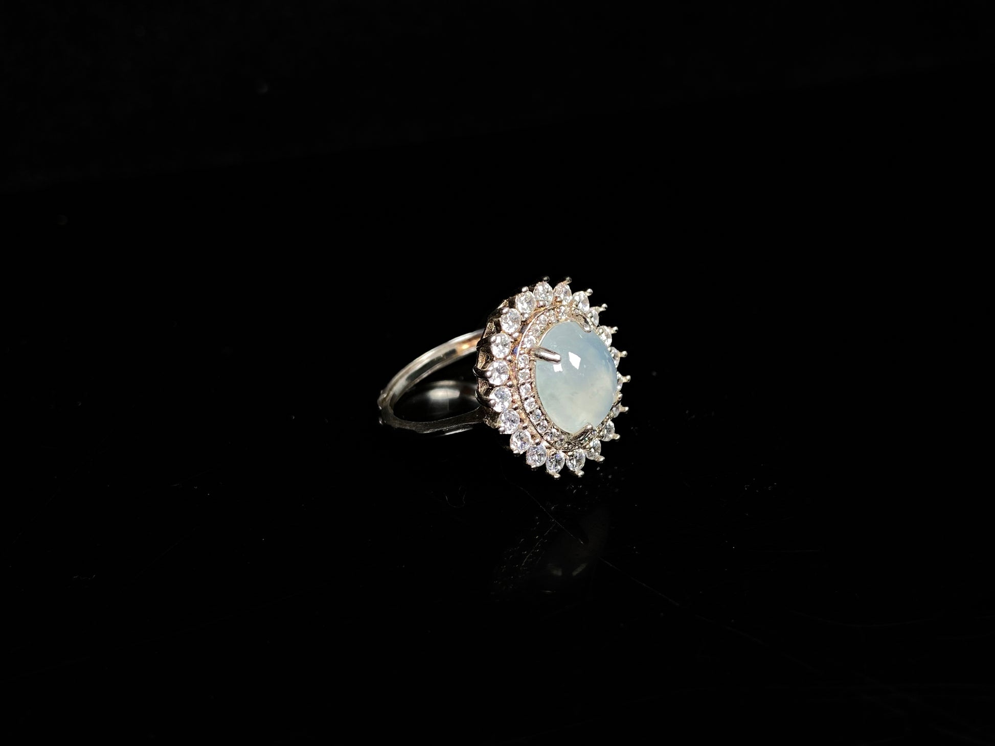 A pale blue moon glow jadeite ring.