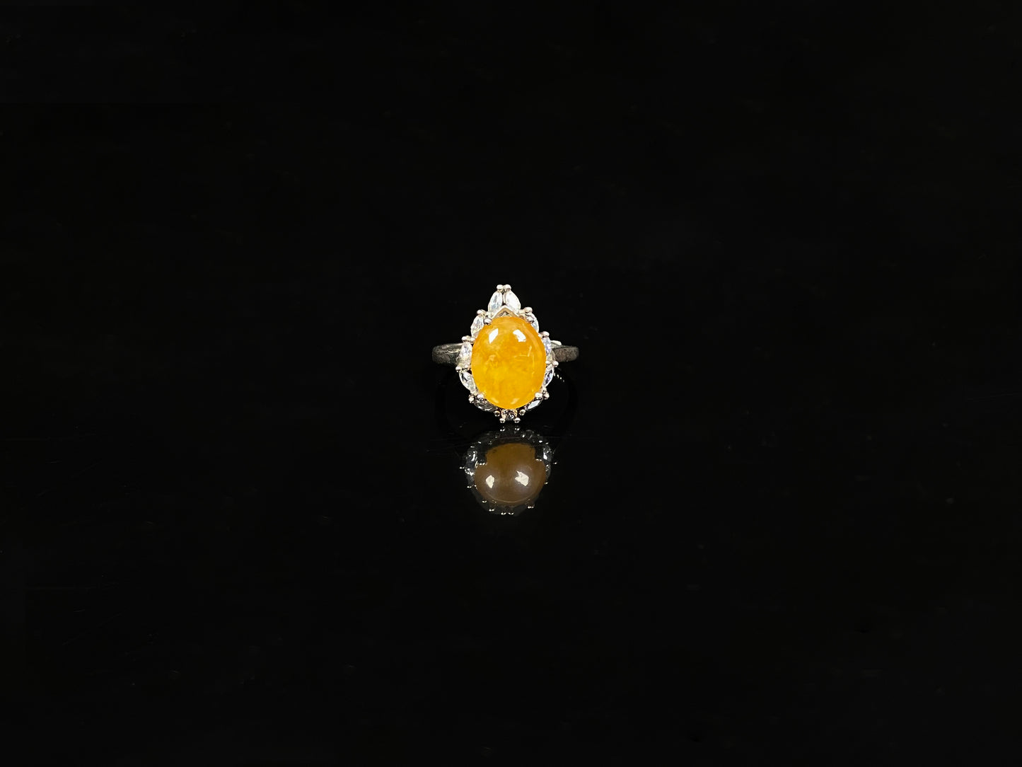 A chrysanthemum sunlit glow jadeite ring.