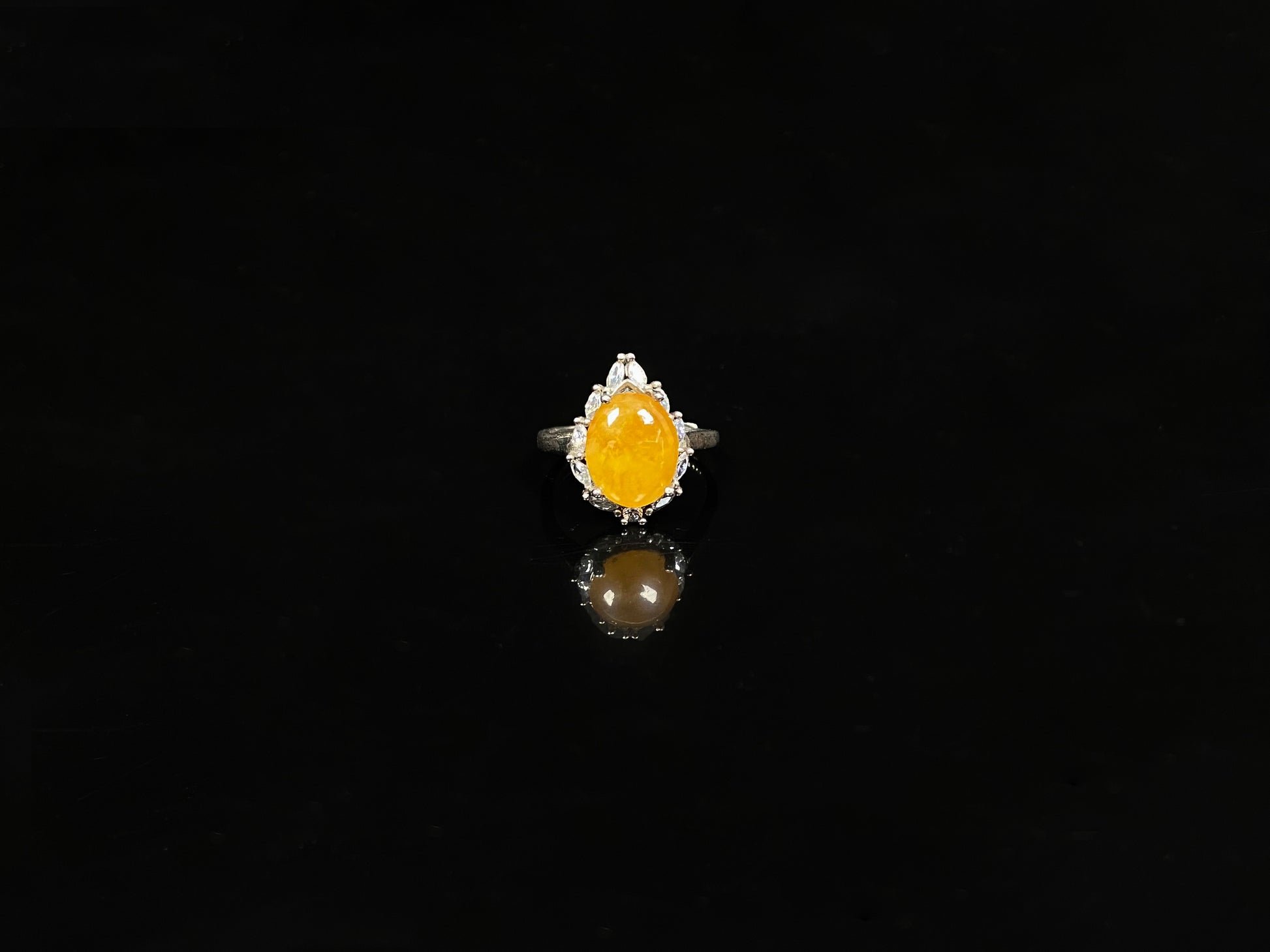 A chrysanthemum sunlit glow jadeite ring.