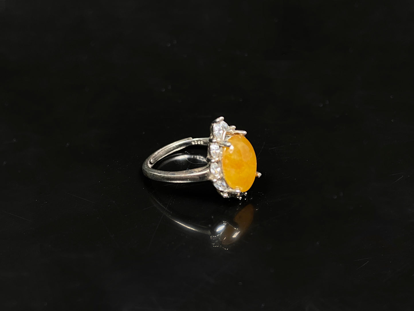 A chrysanthemum sunlit glow jadeite ring.