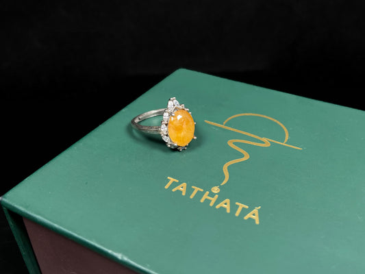 A chrysanthemum sunlit glow jadeite ring.