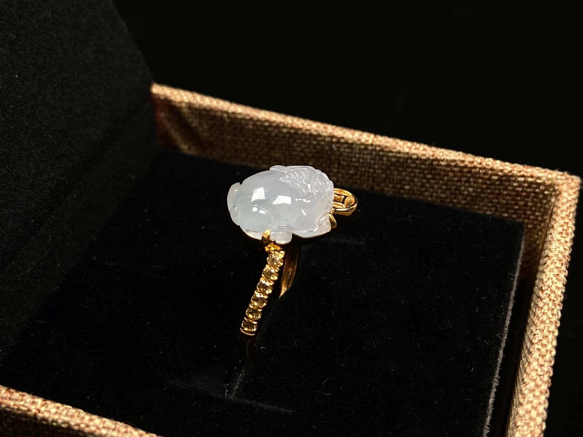 A icy white fortune Pixiu jadeite ring.
