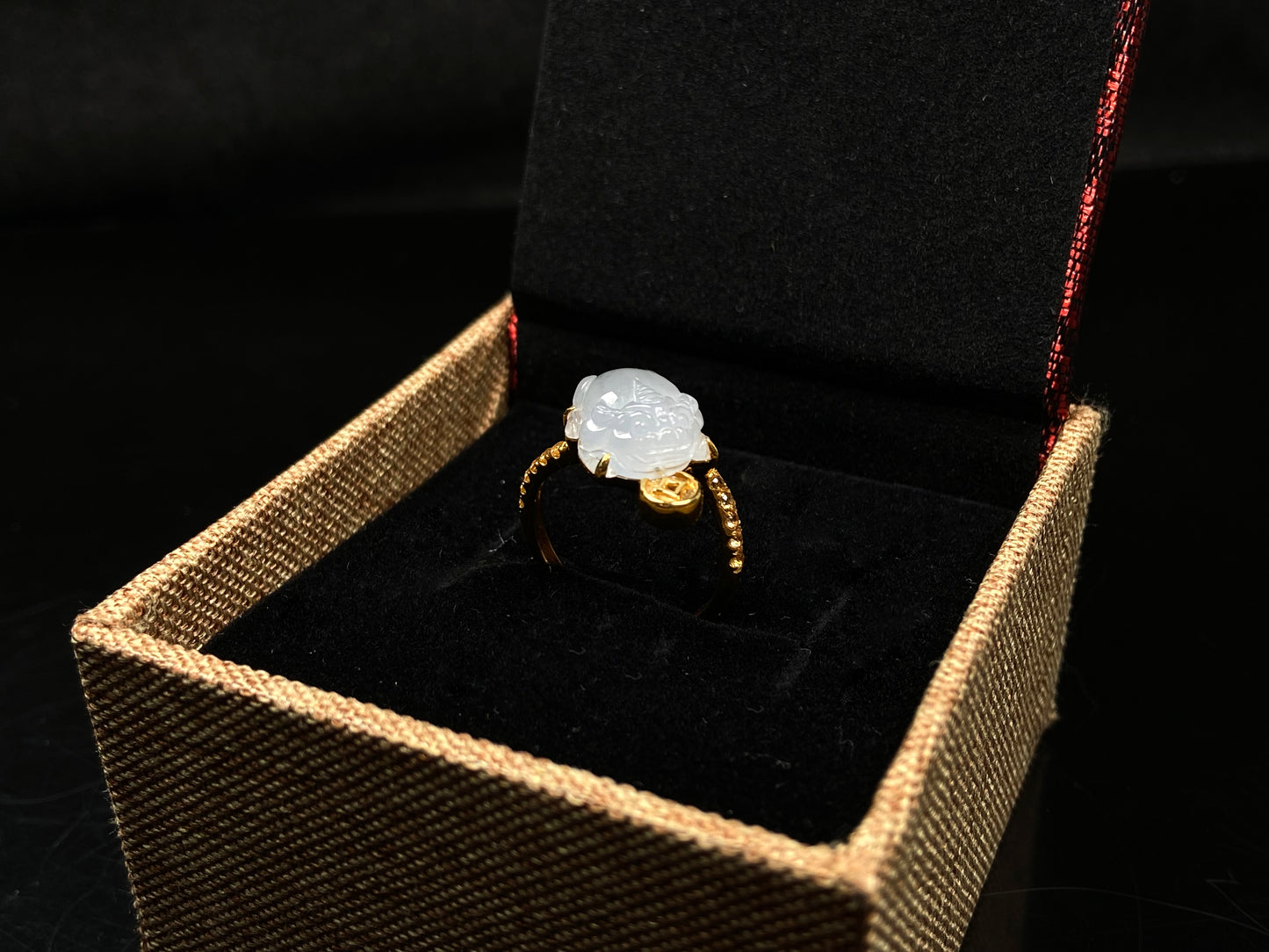 A icy white fortune Pixiu jadeite ring.