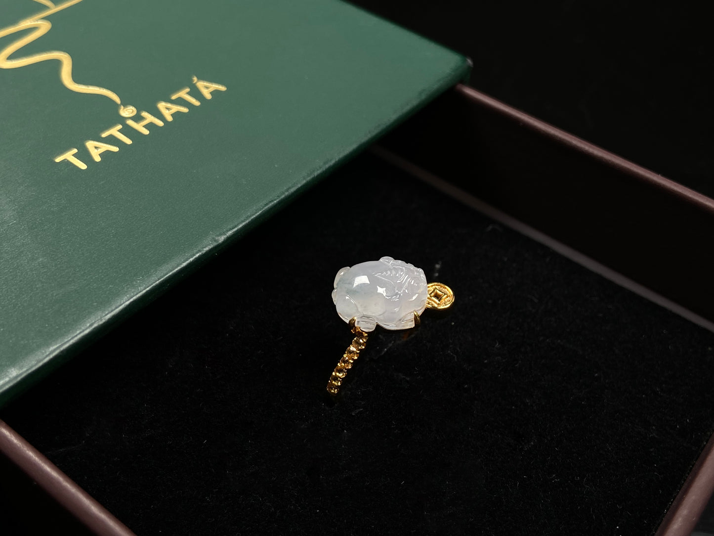A icy white fortune Pixiu jadeite ring.
