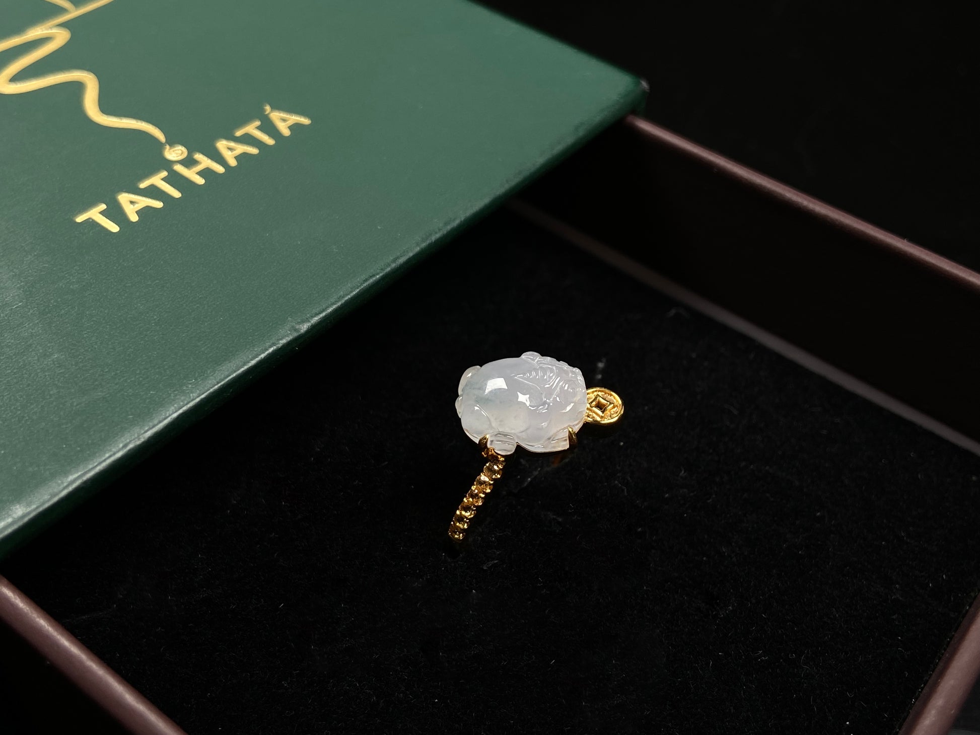 A icy white fortune Pixiu jadeite ring.