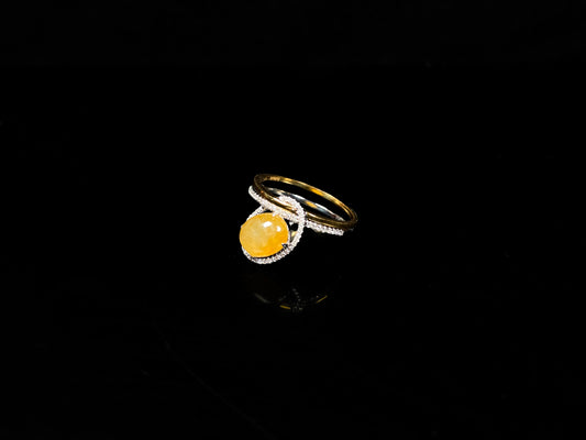 A yellow interlock star halo jadeite ring.
