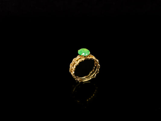 A golden wave apple hue jadeite ring.