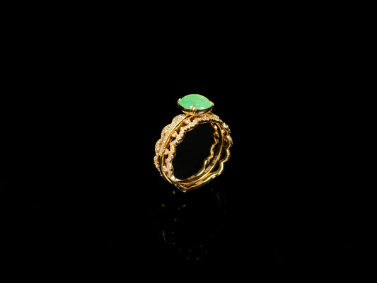 A golden wave apple hue jadeite ring.