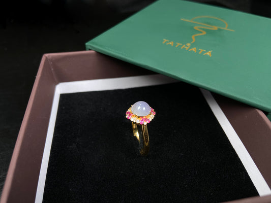 A round lavender pink accent jadeite ring.