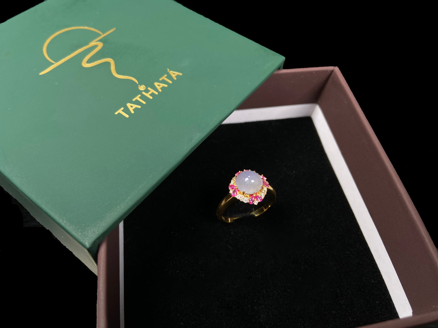 A round lavender pink accent jadeite ring.