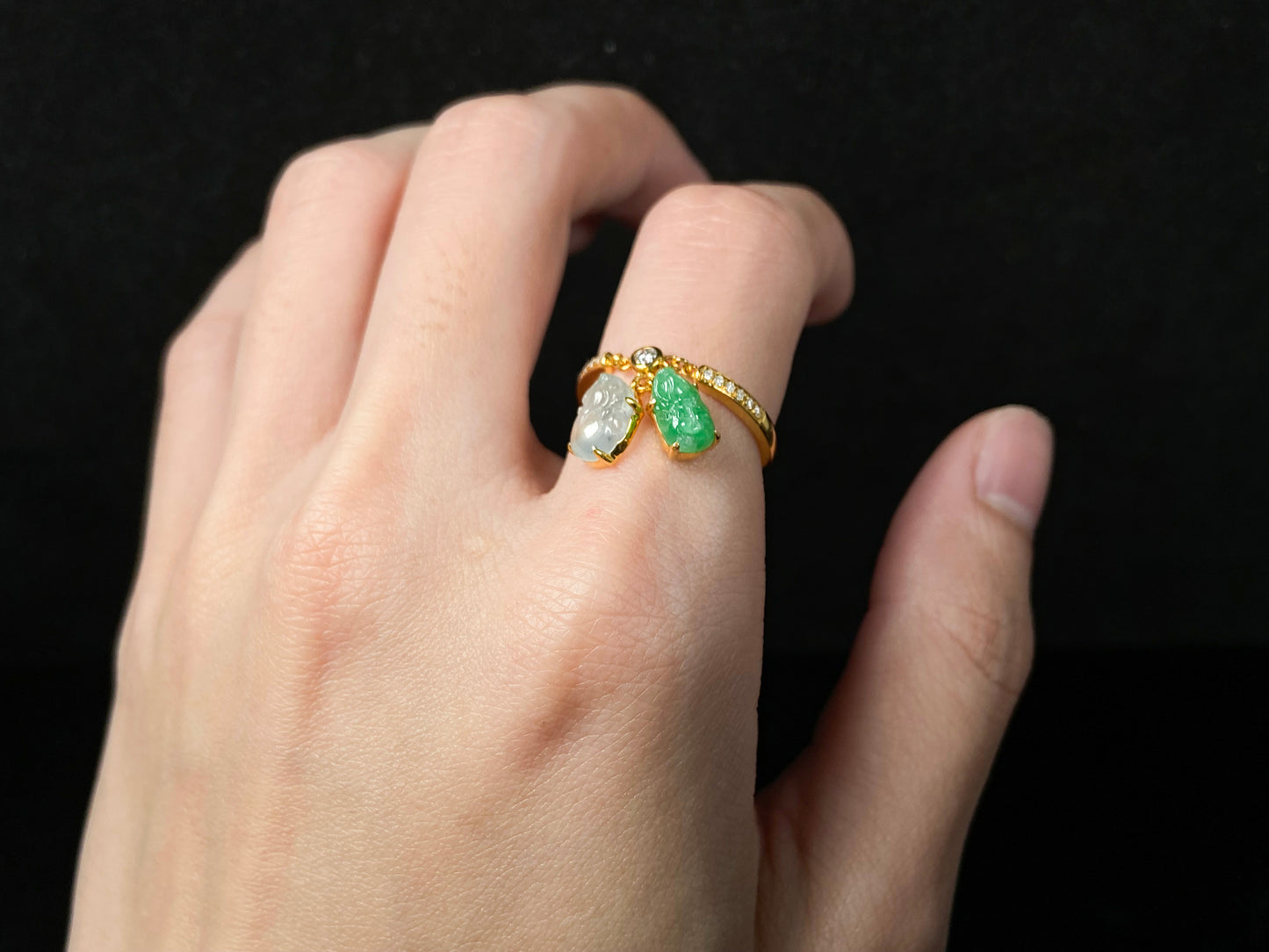 A icy white green dangling twin Pixiu jadeite ring.