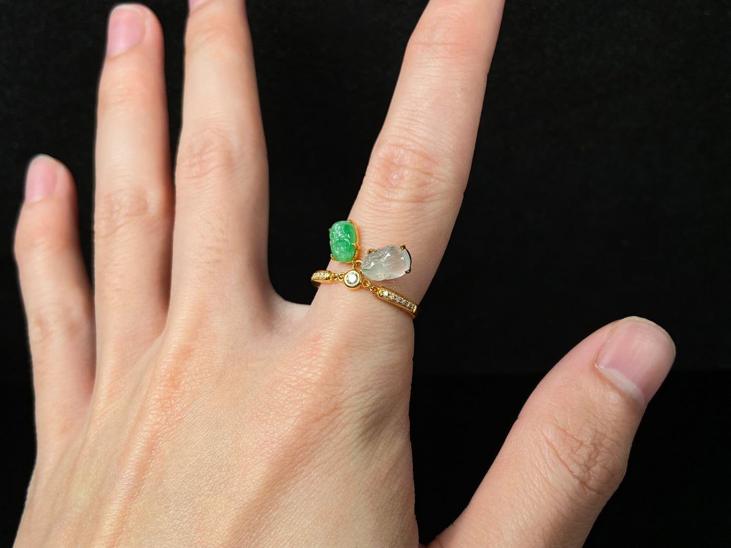 A icy white green dangling twin Pixiu jadeite ring.