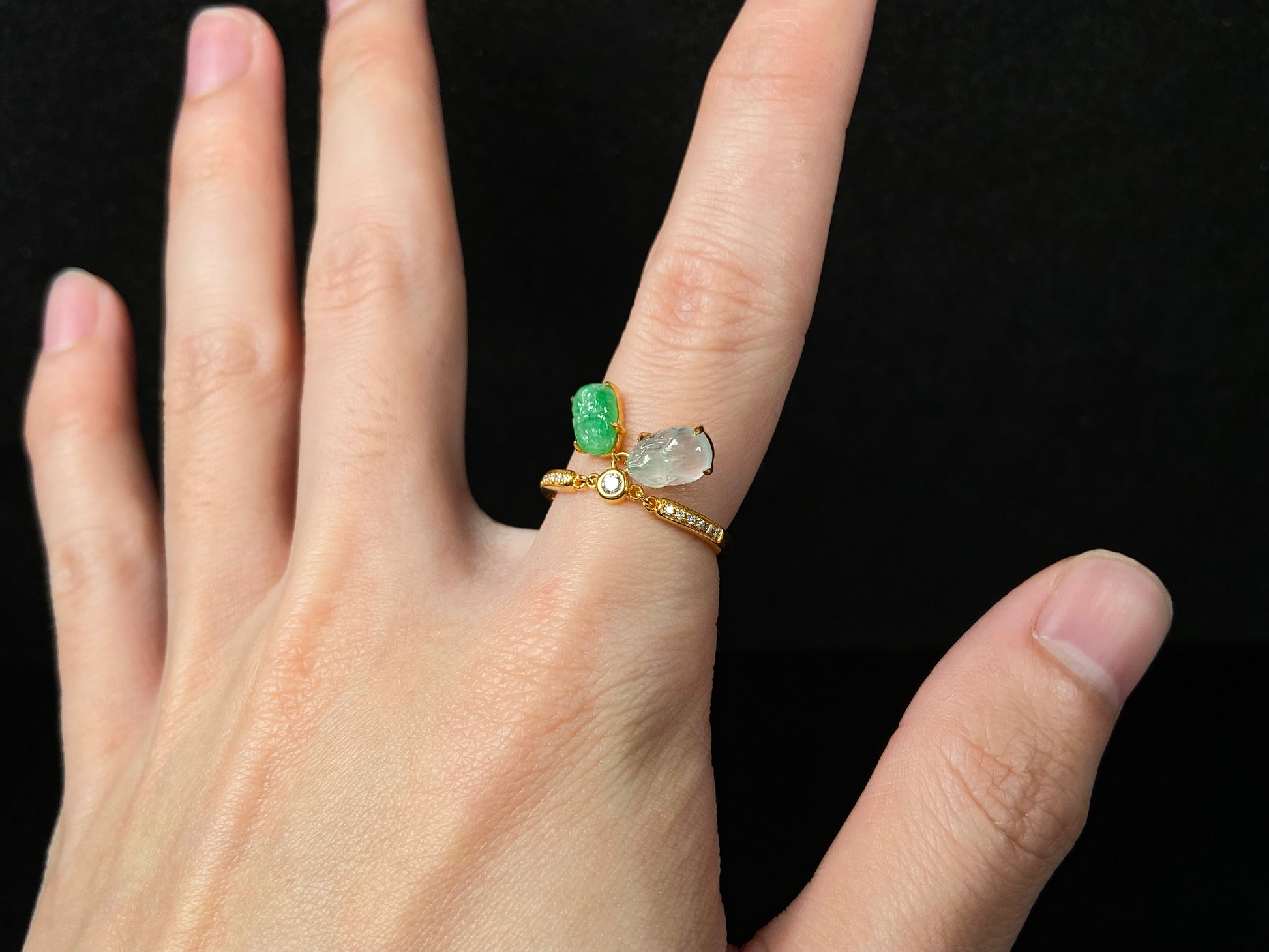 A icy white green dangling twin Pixiu jadeite ring.