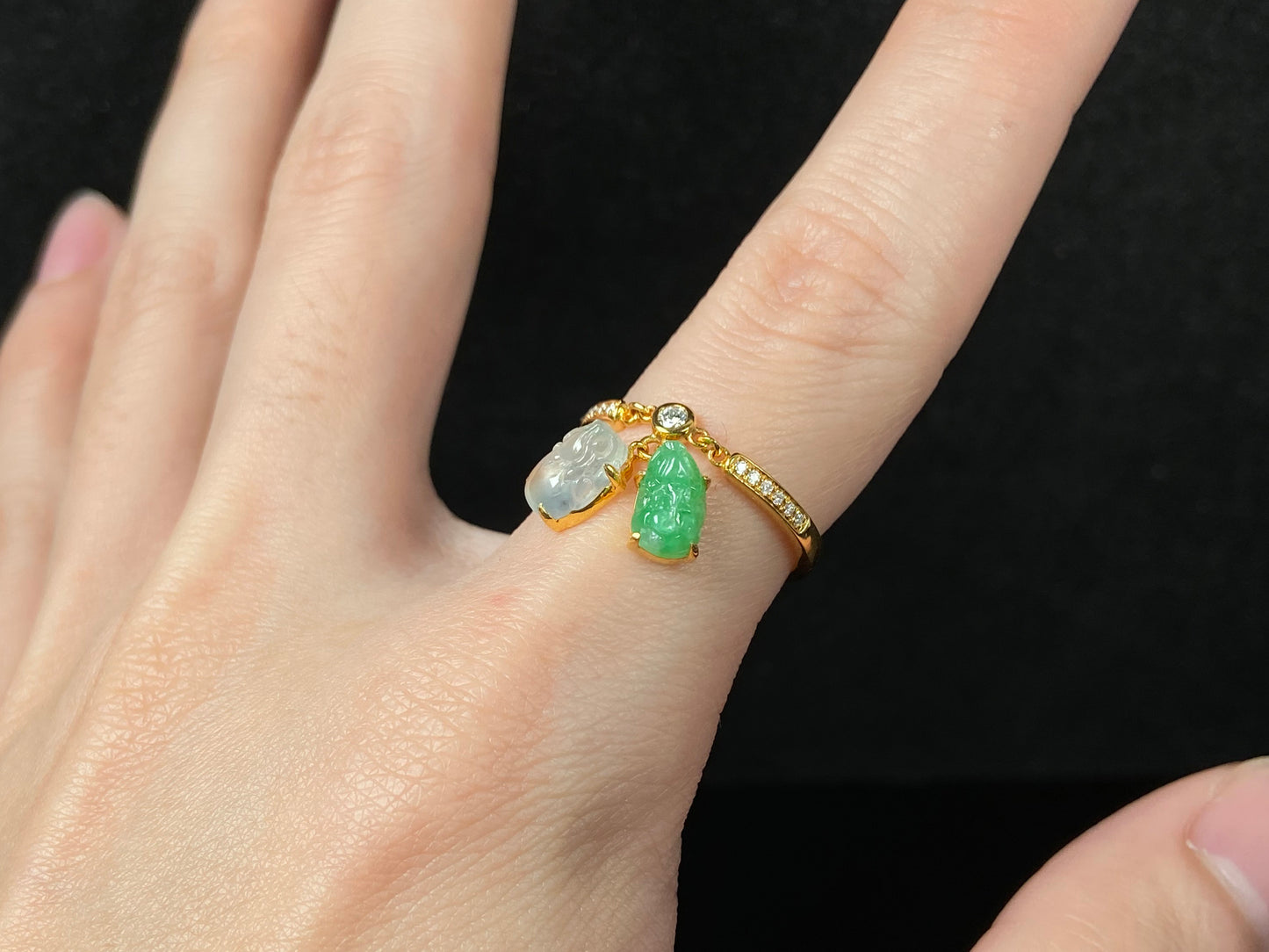 A icy white green dangling twin Pixiu jadeite ring.