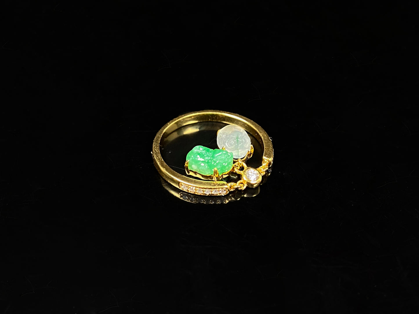 A icy white green dangling twin Pixiu jadeite ring.