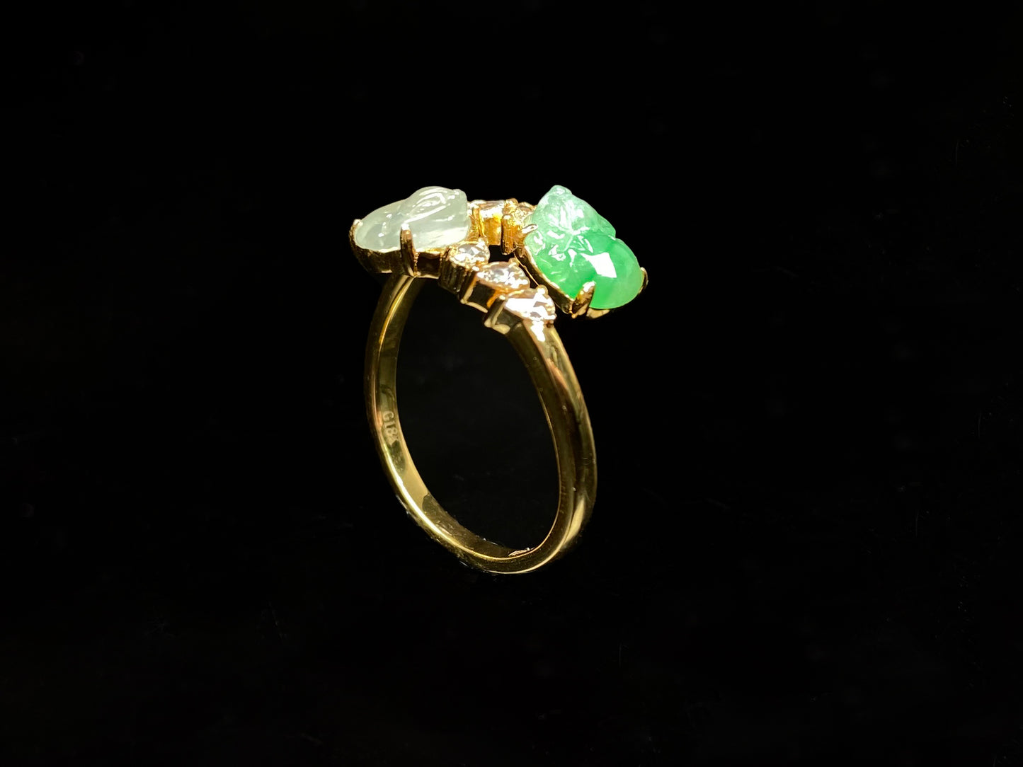 A icy white green twin Pixiu jadeite ring.