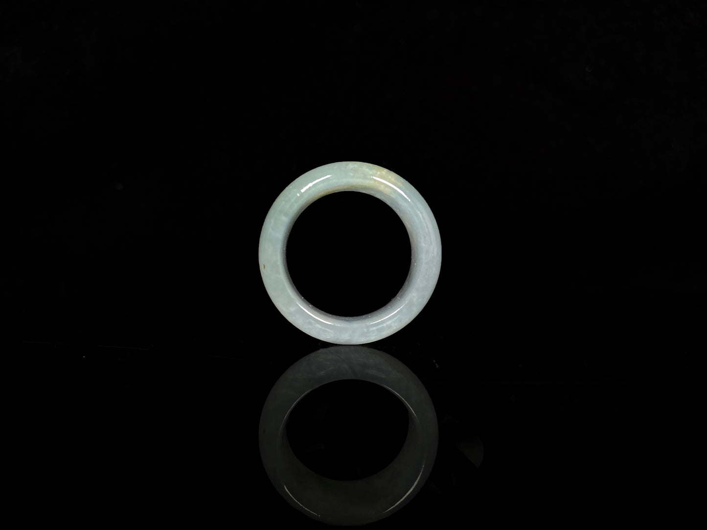 A pale celadon with a hint of yellow  jadeite ring.