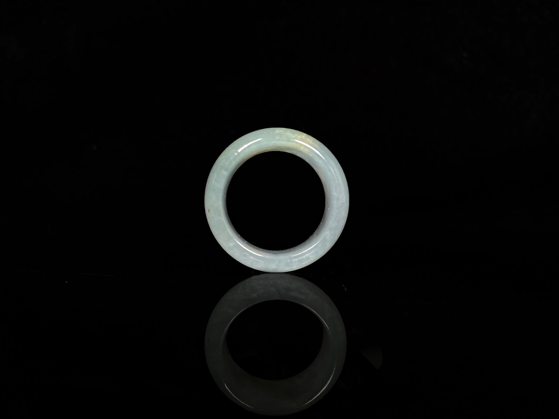 A pale celadon with a hint of yellow  jadeite ring.