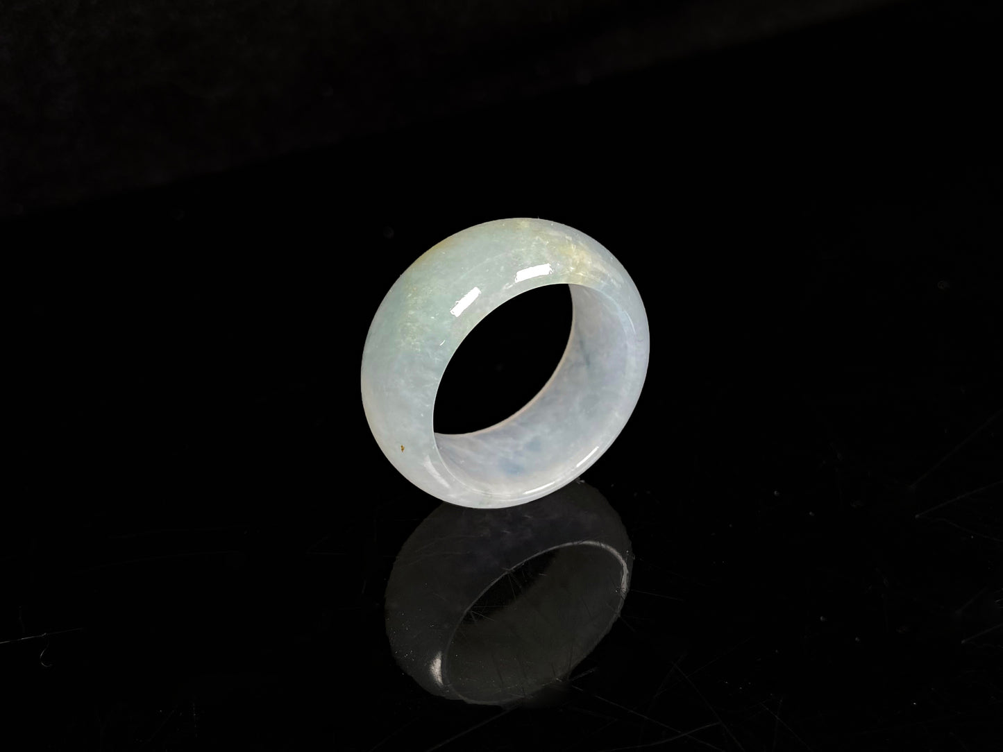 A pale celadon with a hint of yellow  jadeite ring.
