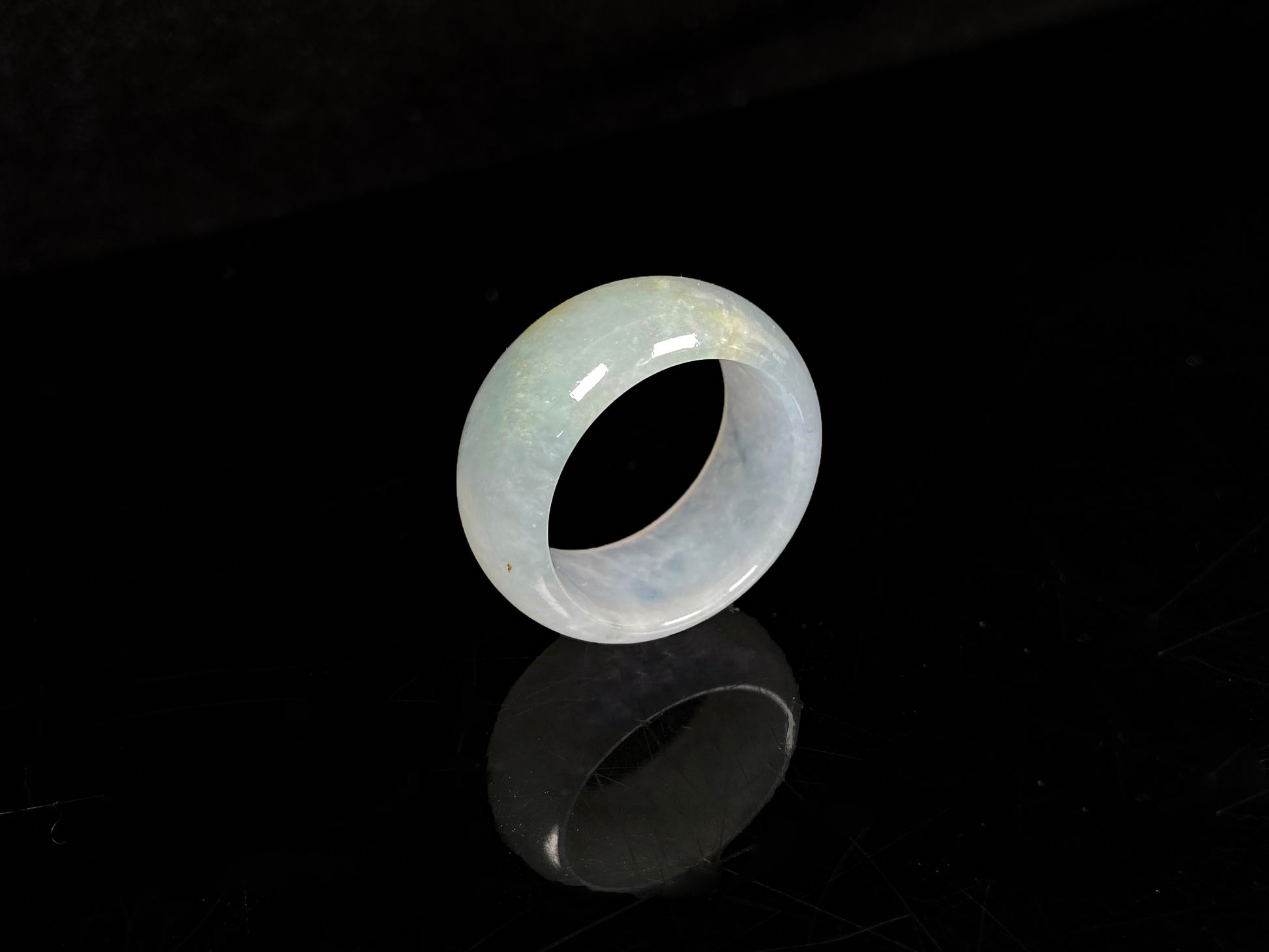 A pale celadon with a hint of yellow  jadeite ring.