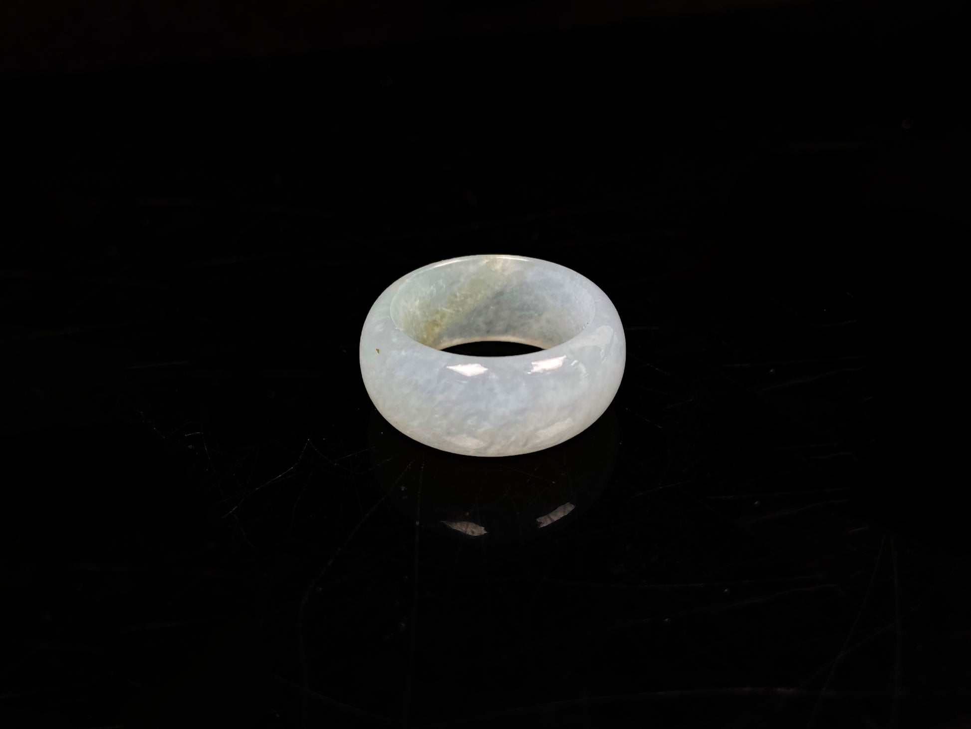 A pale celadon with a hint of yellow  jadeite ring.