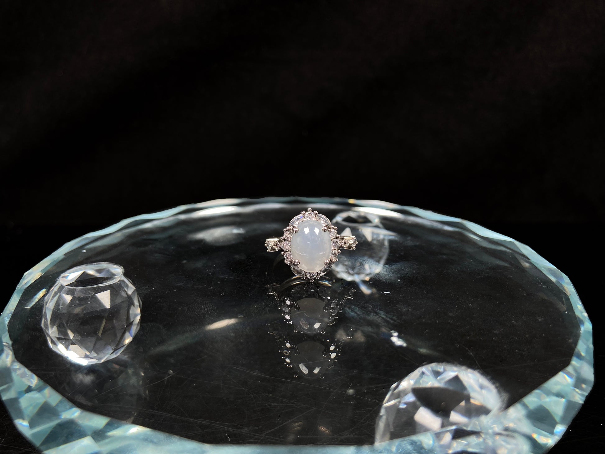 A pale white luminous translucence jadeite ring.