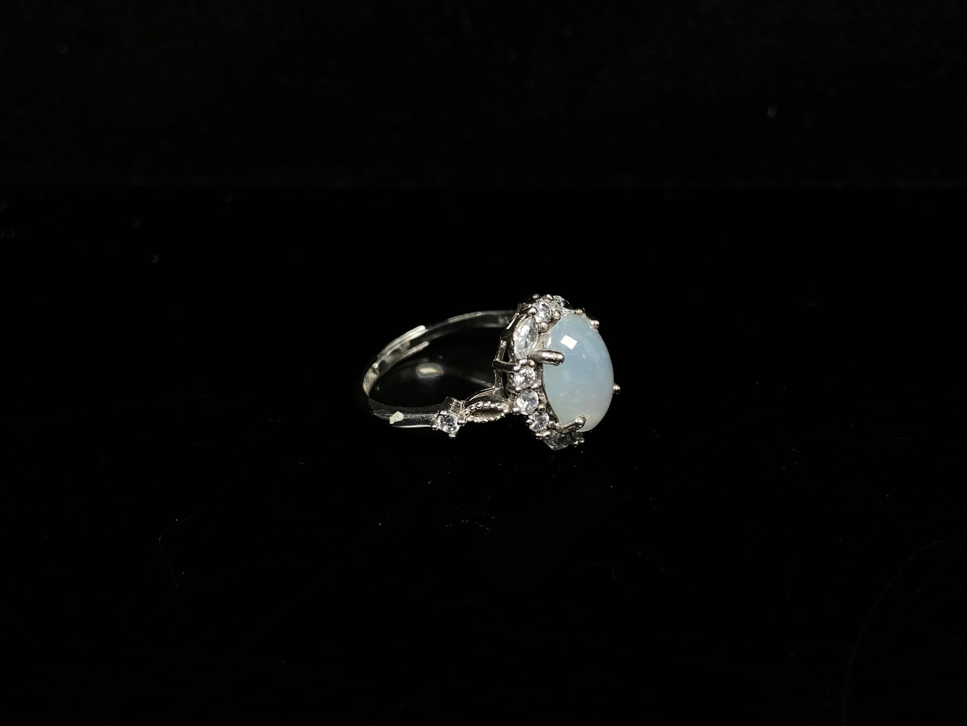 A pale white luminous translucence jadeite ring.