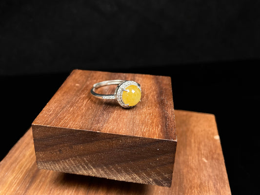 A mango dew hue jadeite ring.
