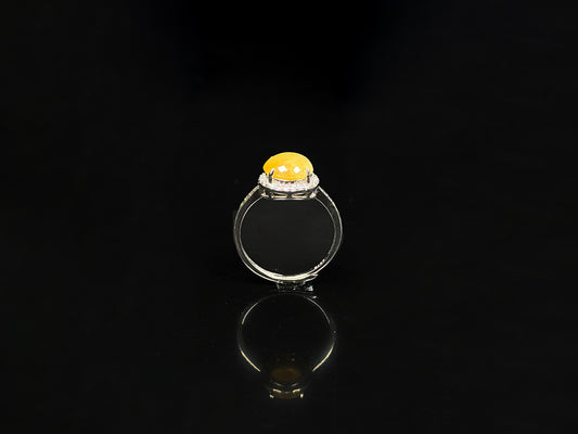 A peach yellow jadeite ring.