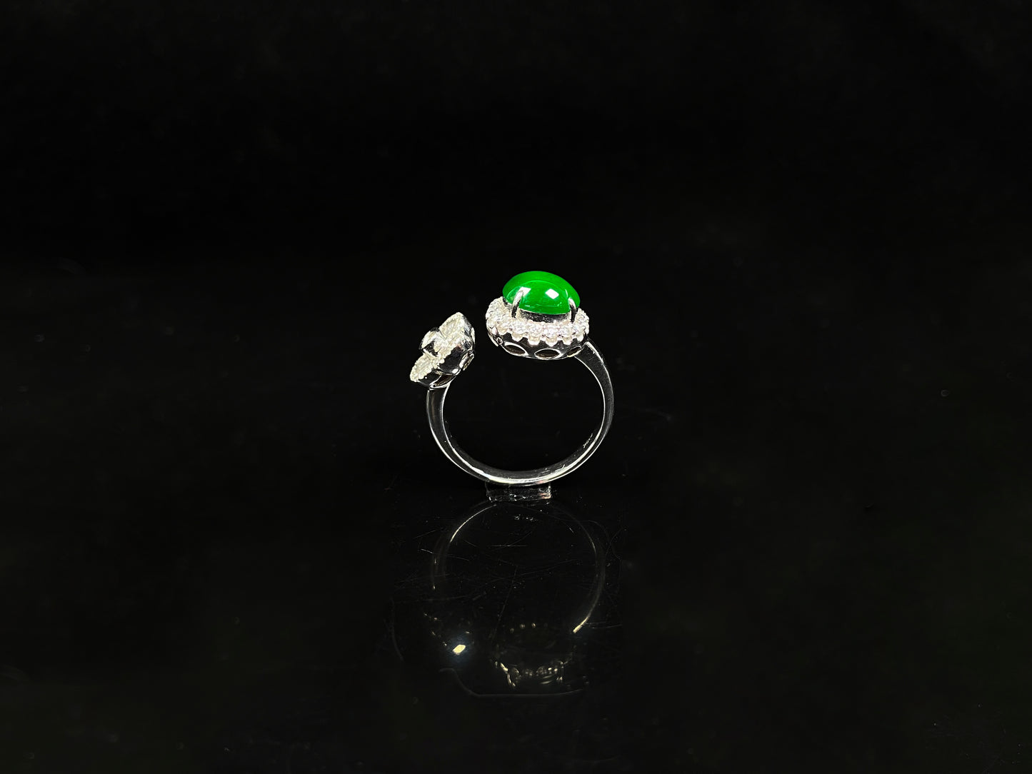 A vivid imperial green halo jadeite ring.