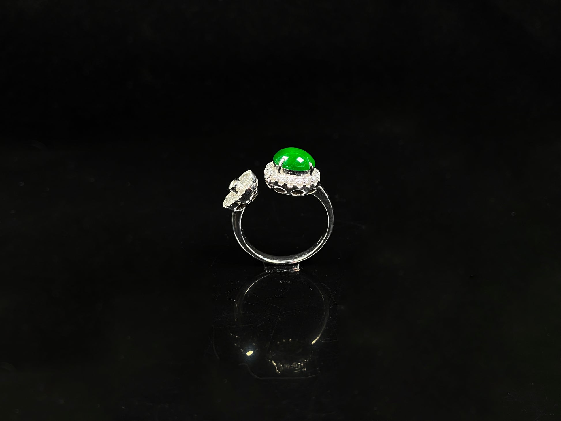 A vivid imperial green halo jadeite ring.