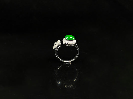 A vivid imperial green halo jadeite ring.