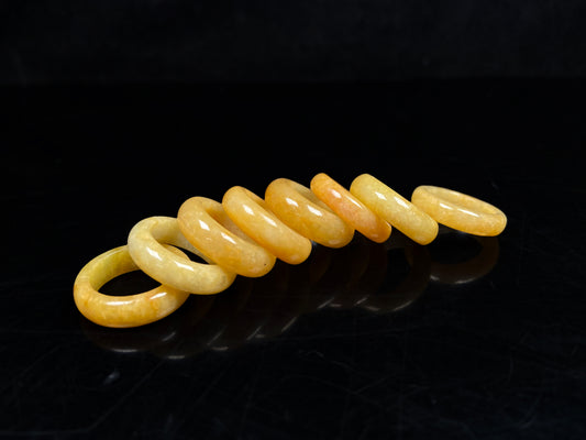 A golden fortune warmth jadeite ring group.