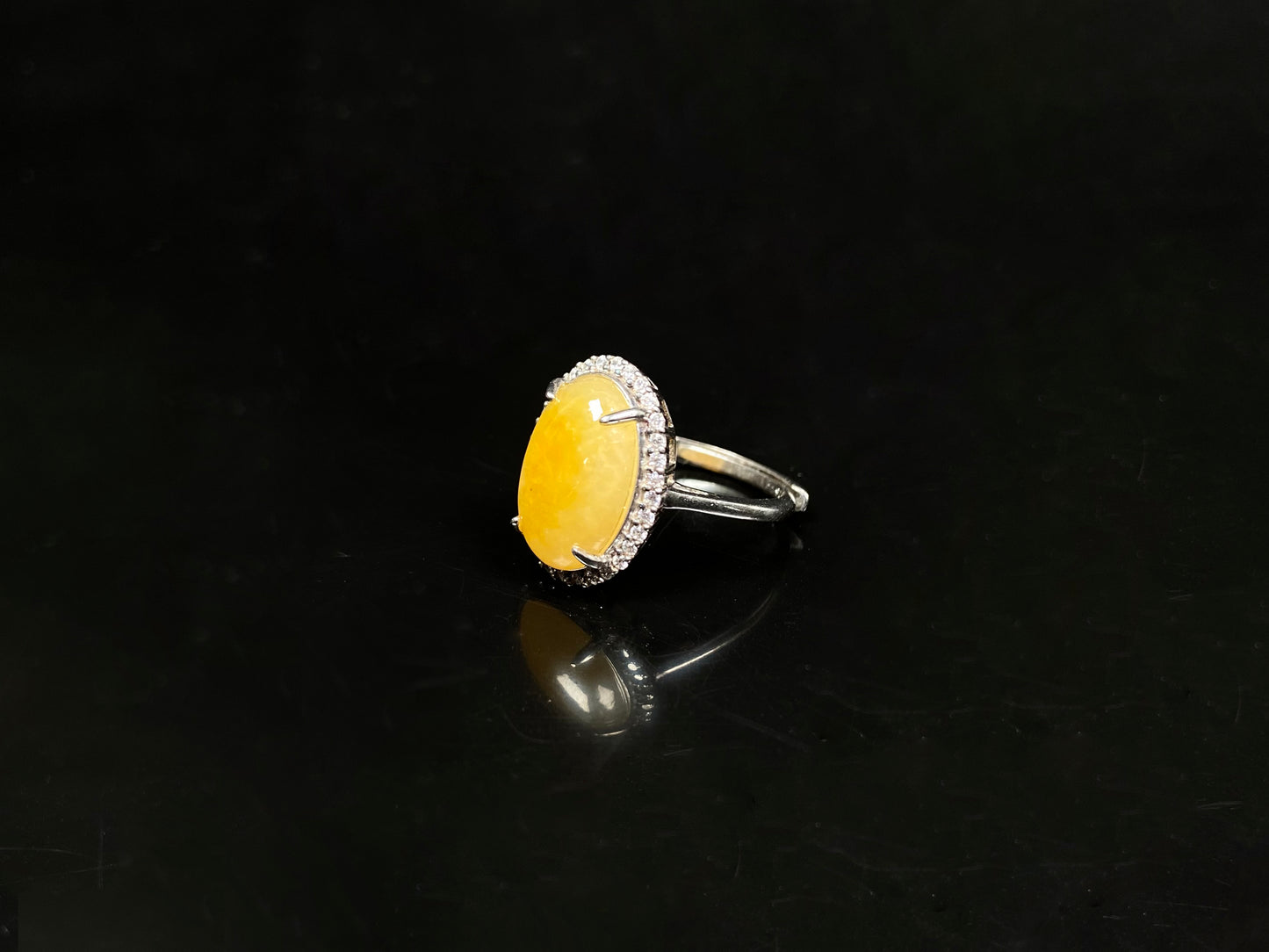 A sunlit marigold drop jadeite ring.