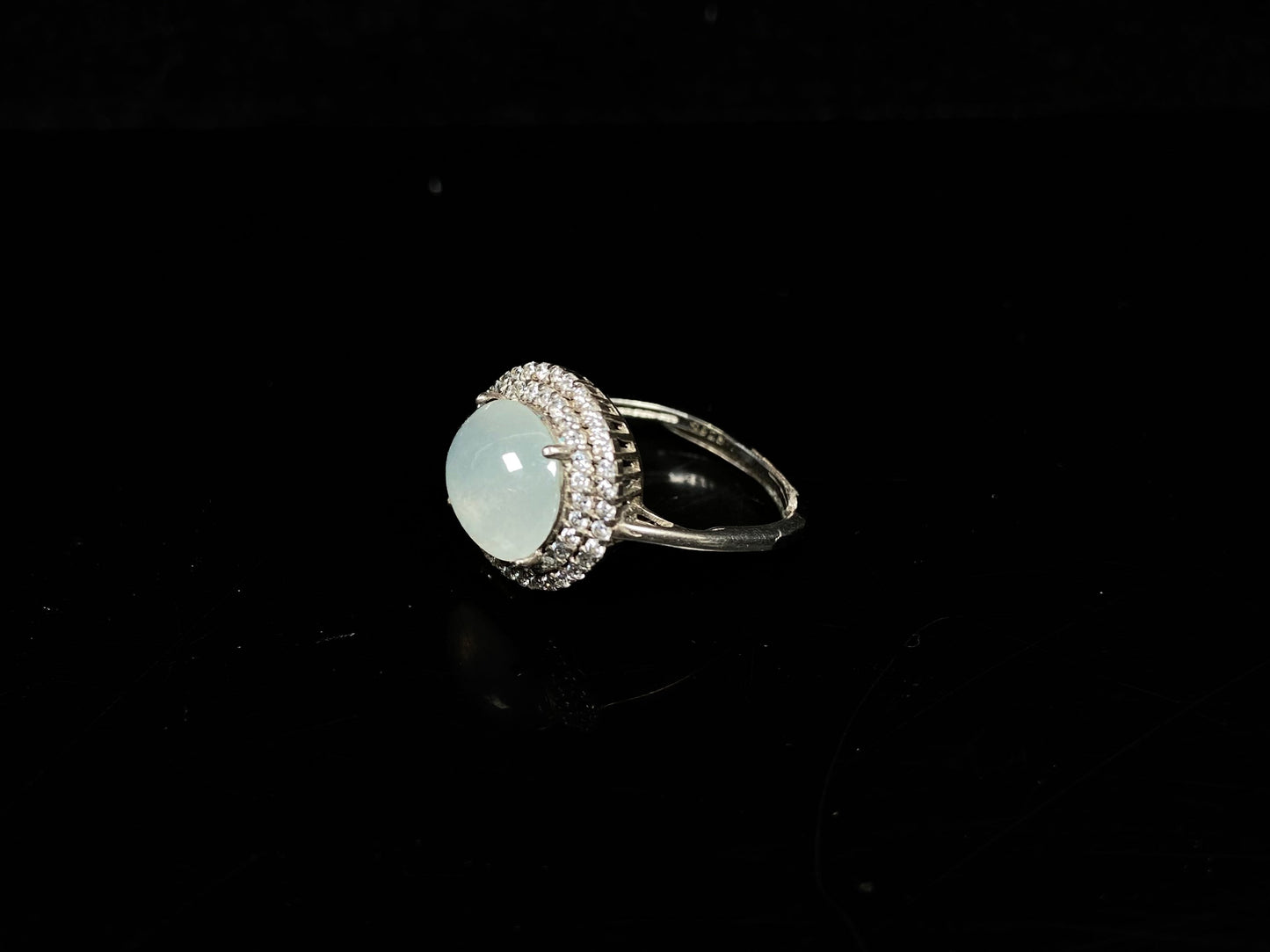 A double halo frost glow jadeite ring.