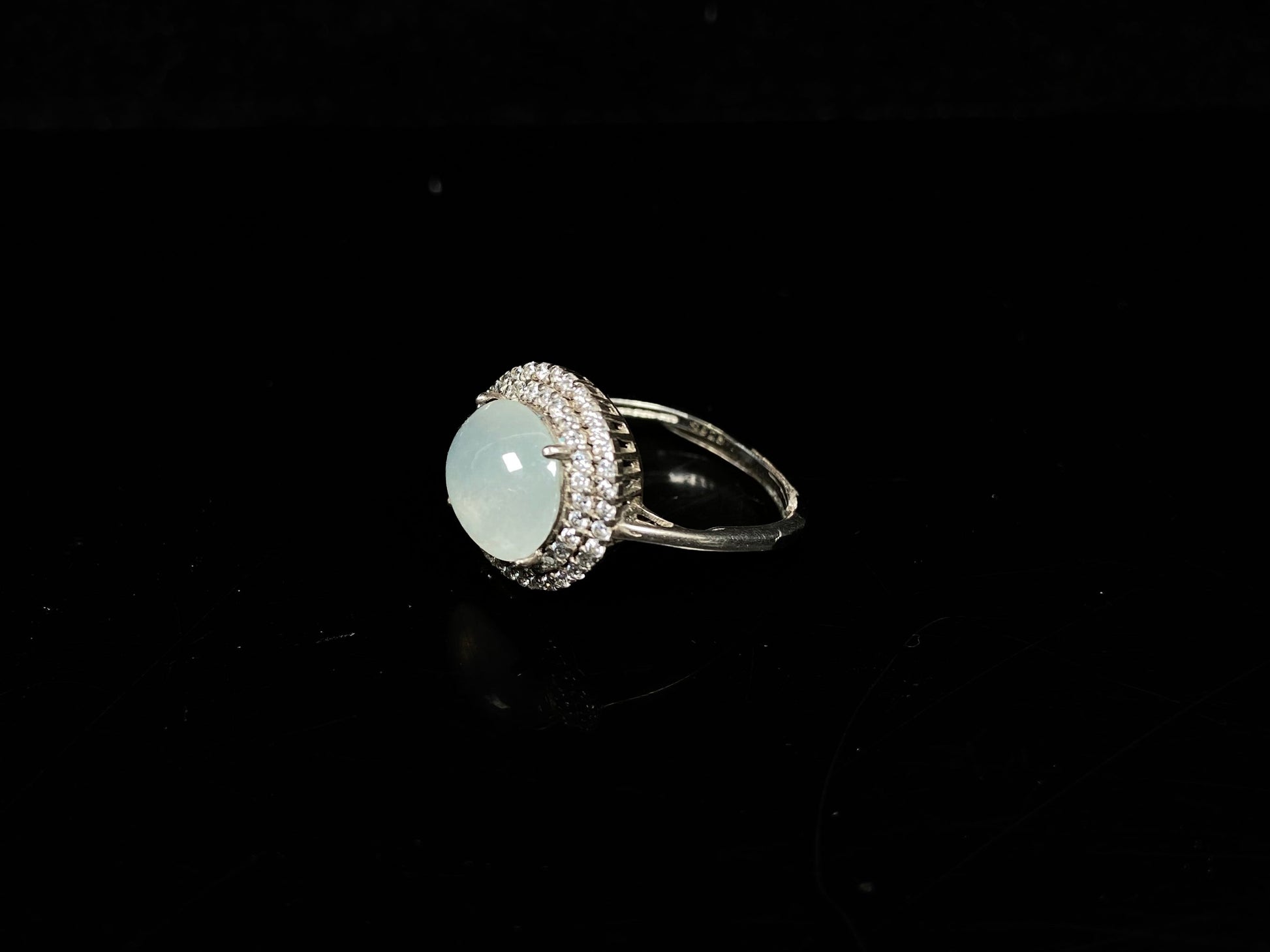 A double halo frost glow jadeite ring.