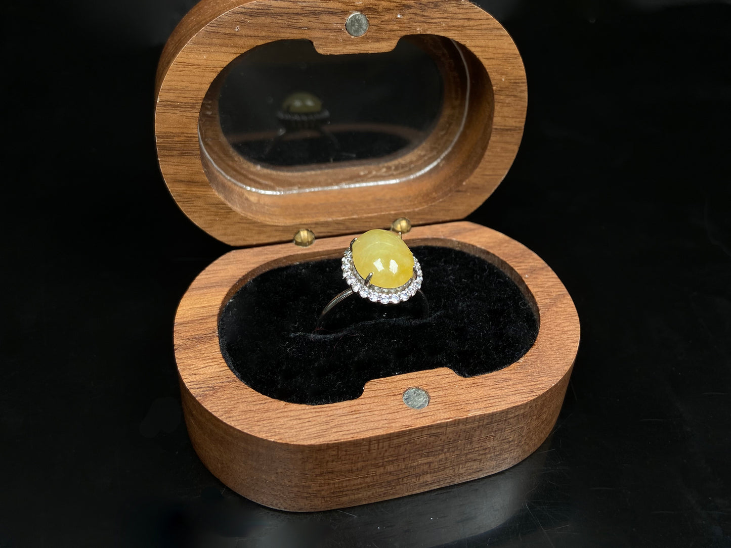 A warm honeyed glimmer jadeite ring.