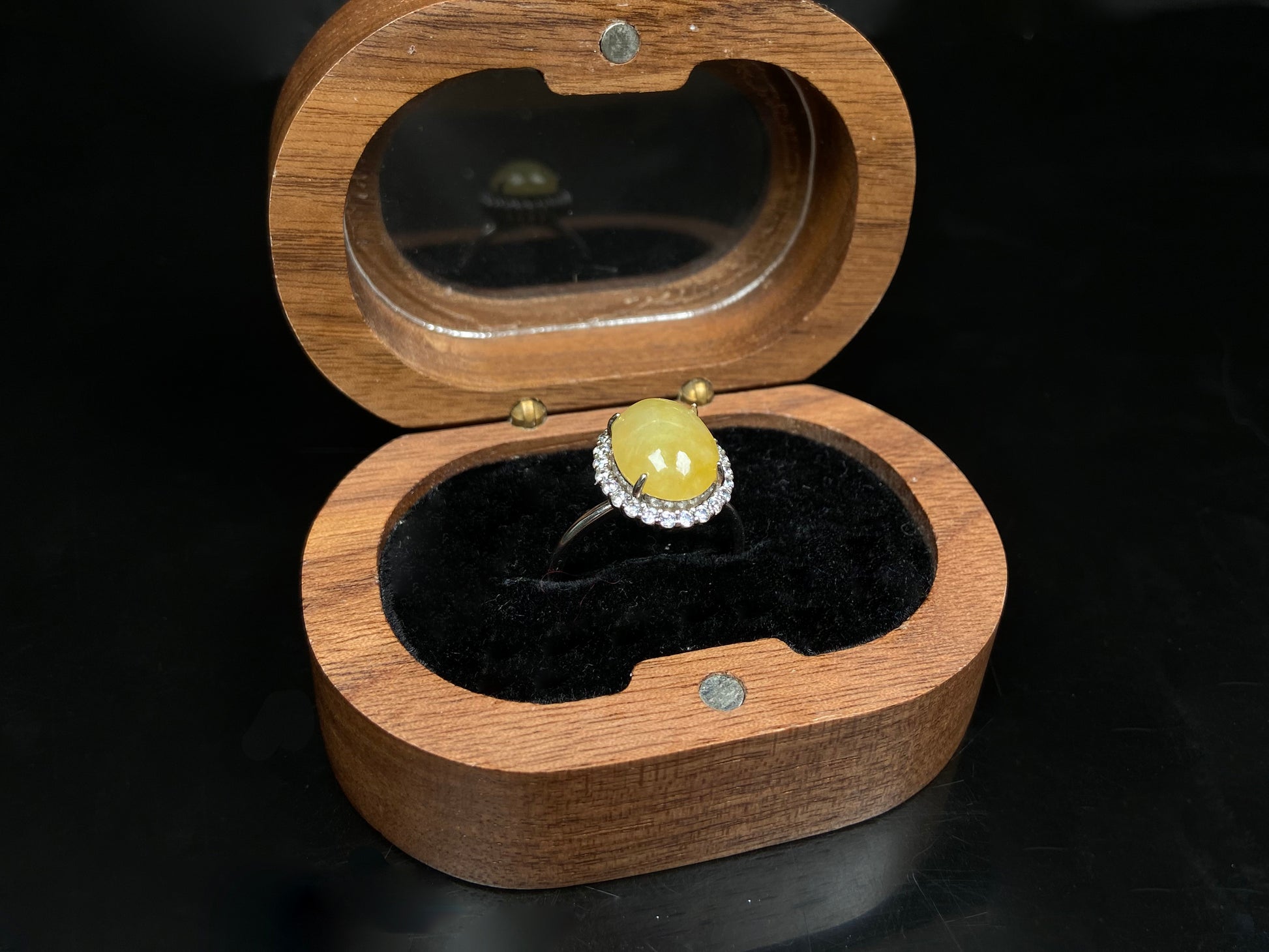 A warm honeyed glimmer jadeite ring.