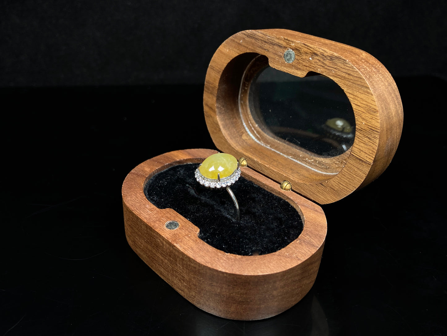 A warm honeyed glimmer jadeite ring.