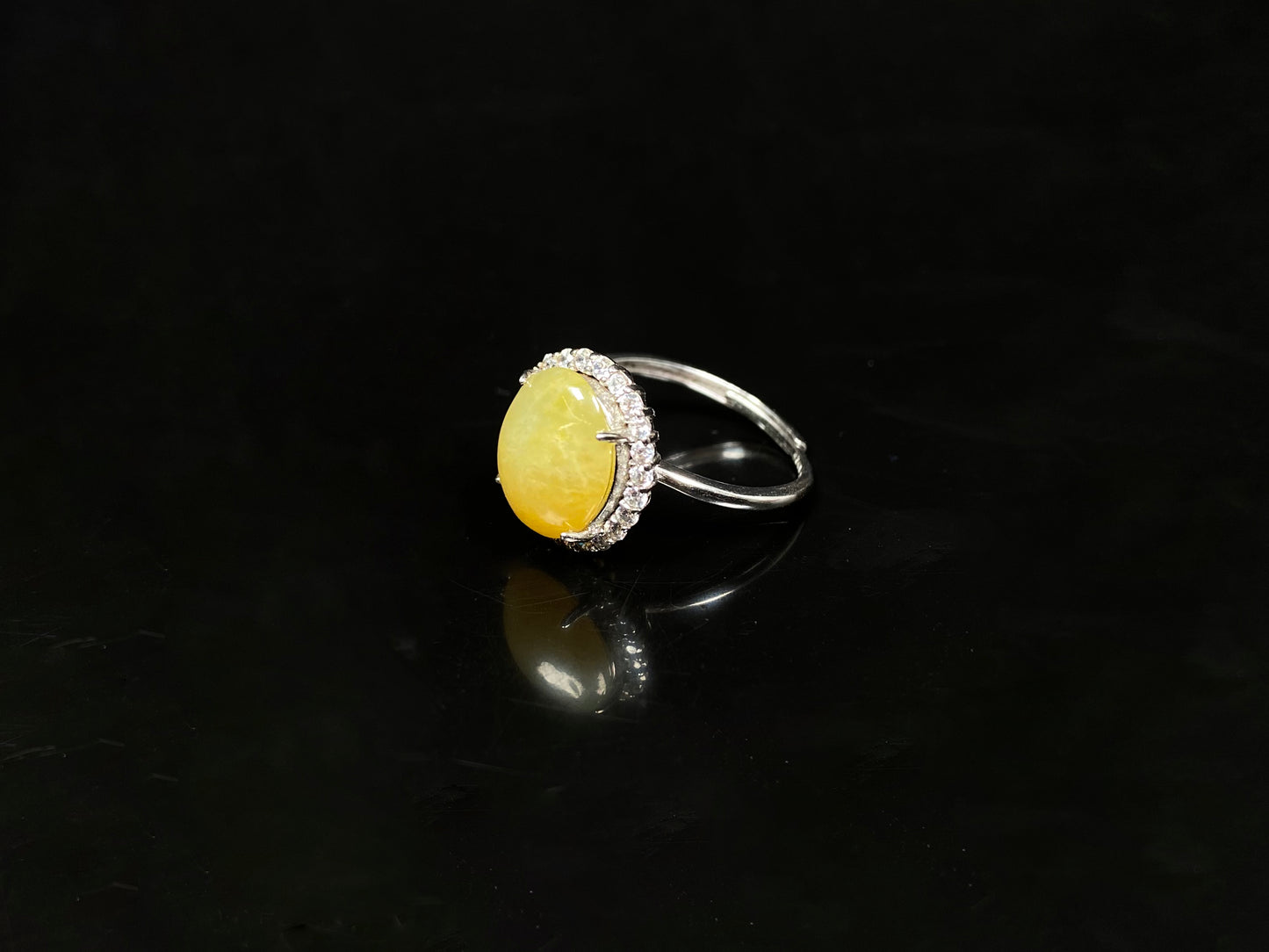 A warm honeyed glimmer jadeite ring.
