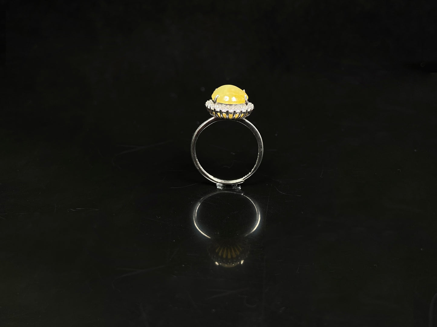 A warm honeyed glimmer jadeite ring.