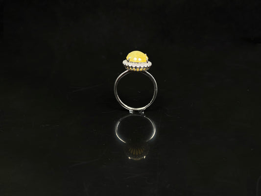 A warm honeyed glimmer jadeite ring.