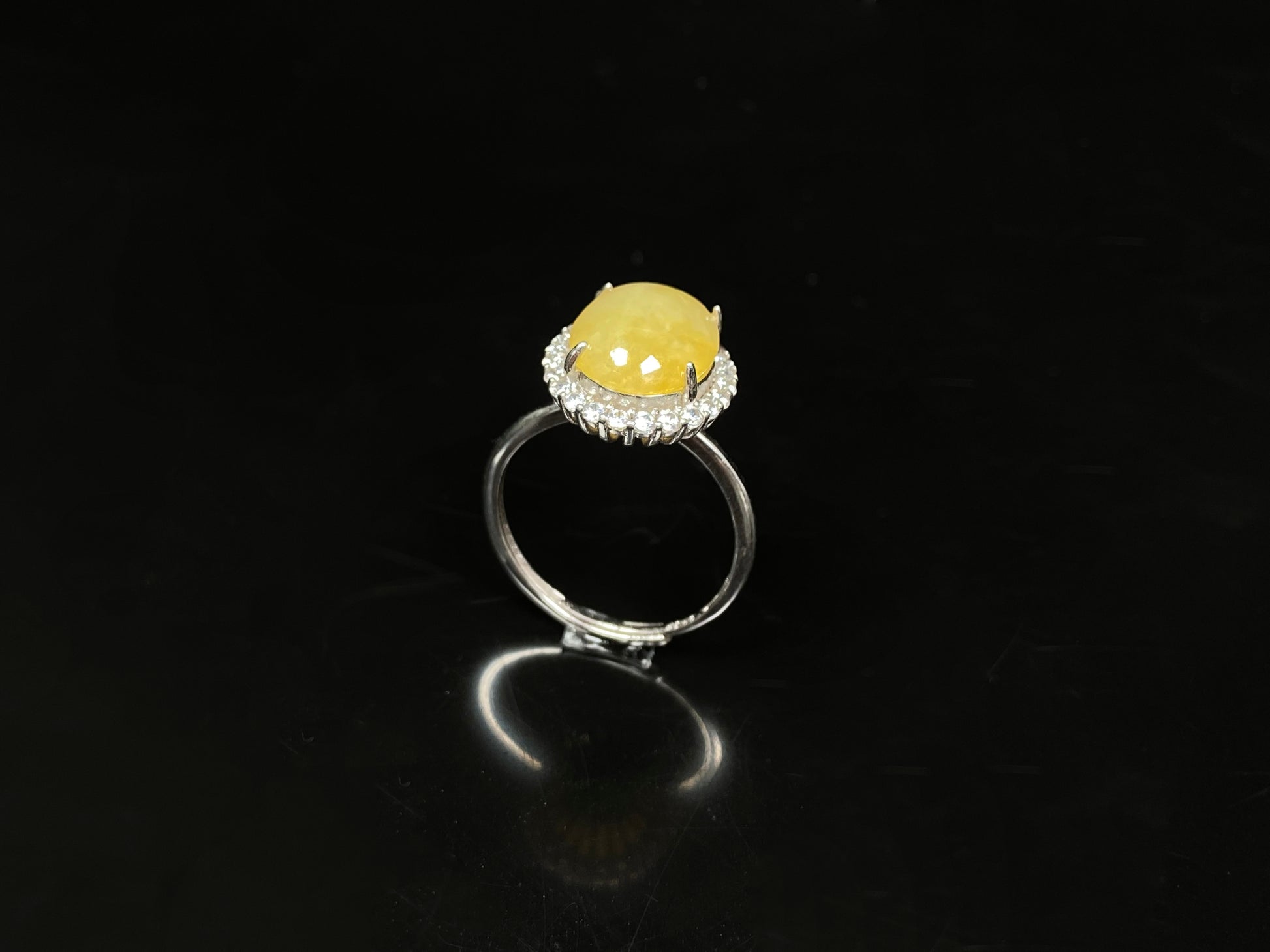 A warm honeyed glimmer jadeite ring.