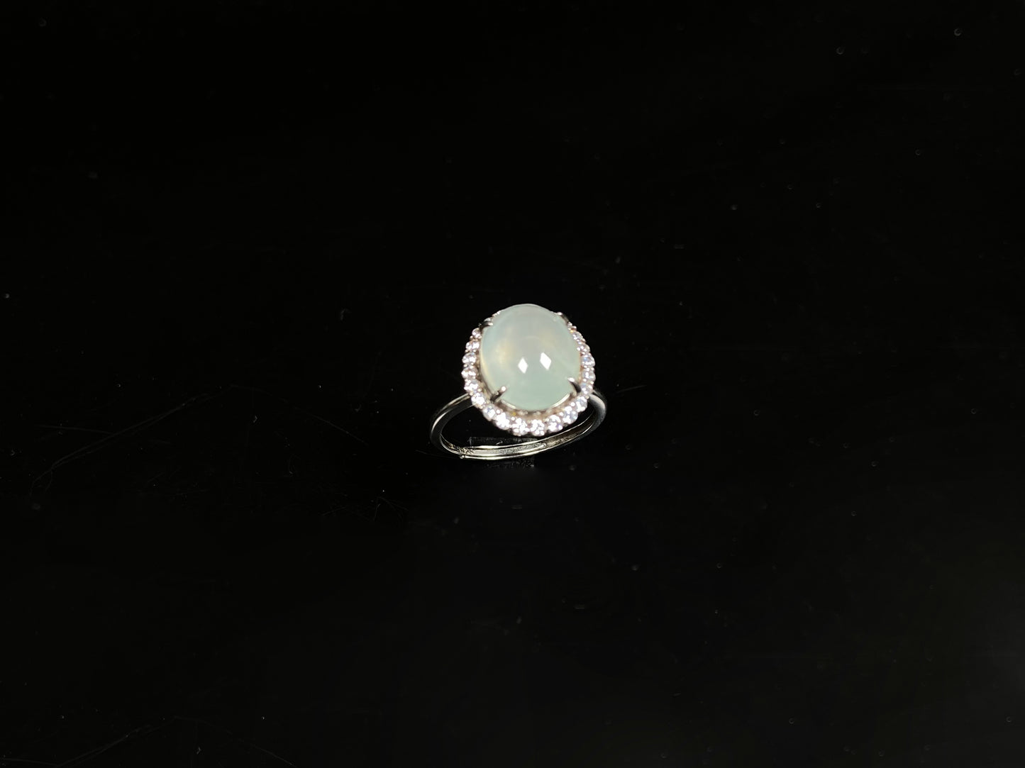 A moonlit frost glimmer jadeite ring.