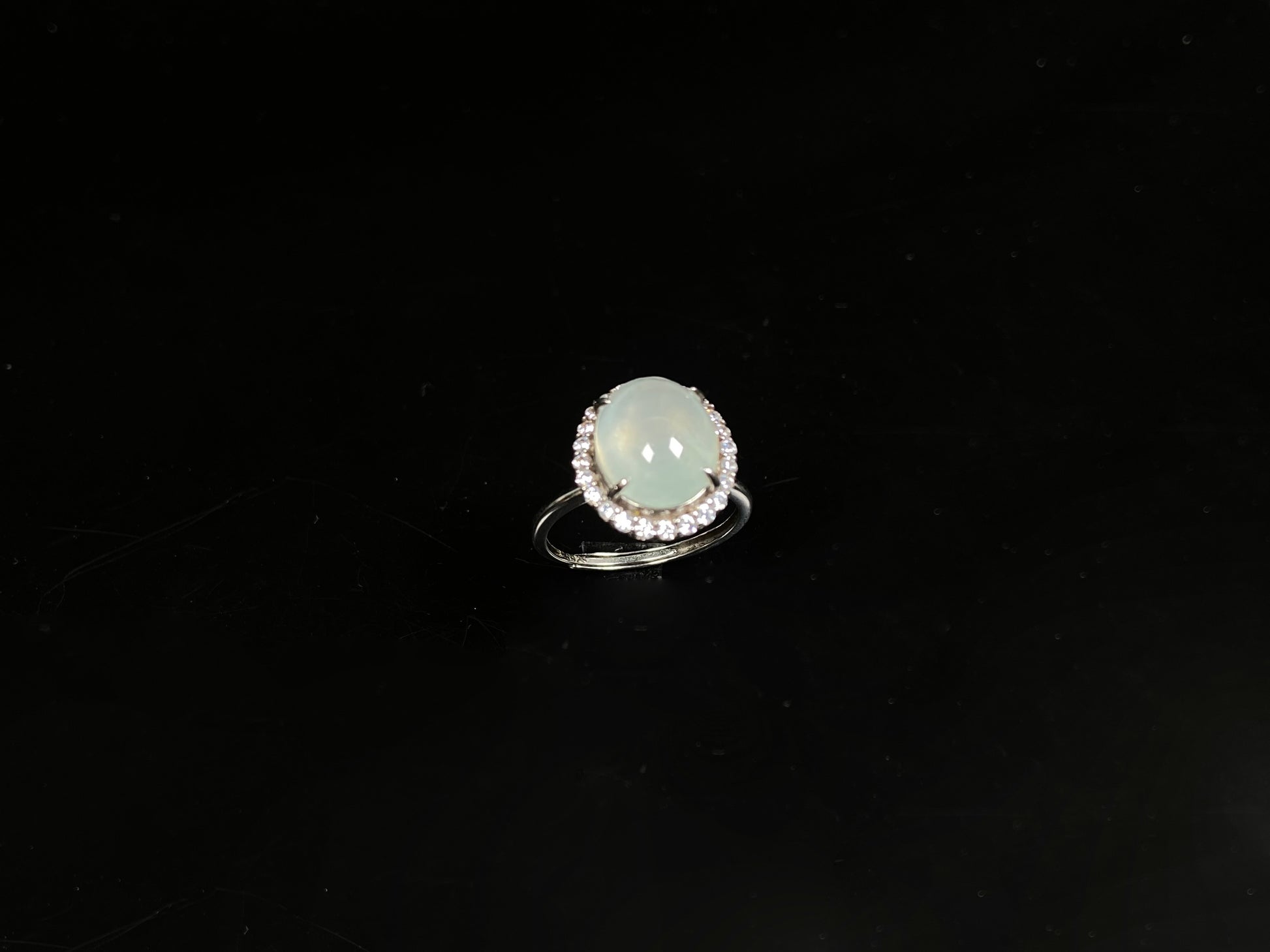 A moonlit frost glimmer jadeite ring.