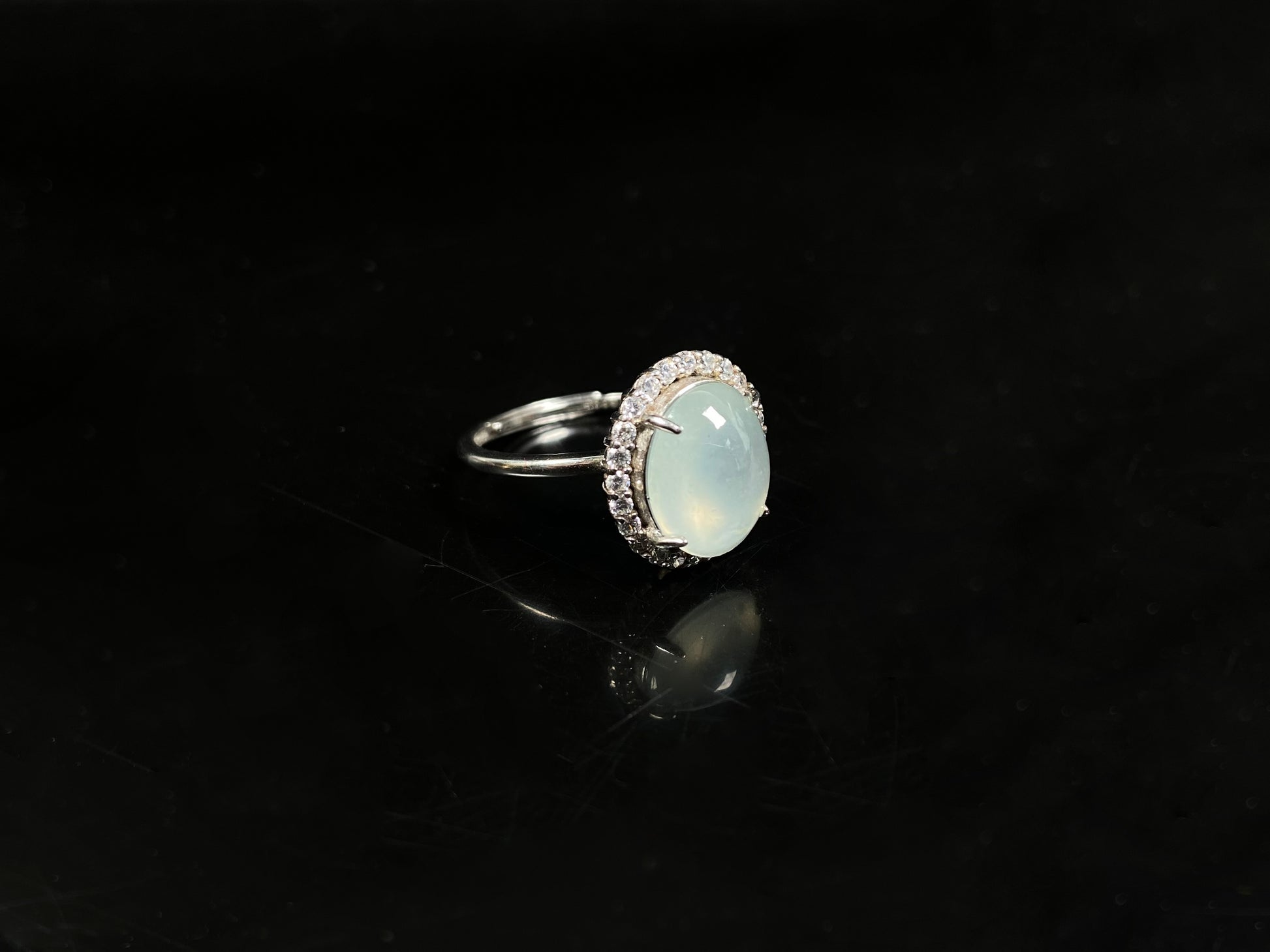 A moonlit frost glimmer jadeite ring.