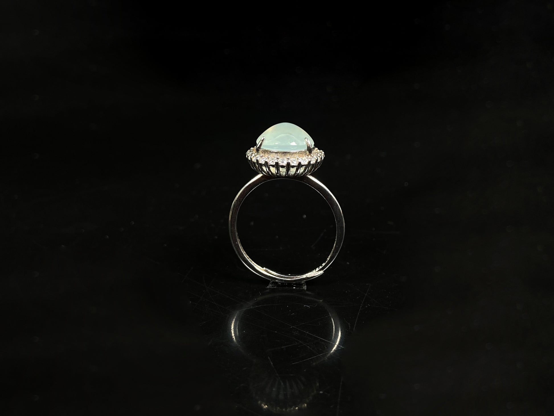 A moonlit frost glimmer jadeite ring.